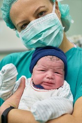 Solana Beach CA LPN pediatric nurse holding infant